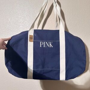 Brand new Navy and white Victoria's Secret pink duffel bag
